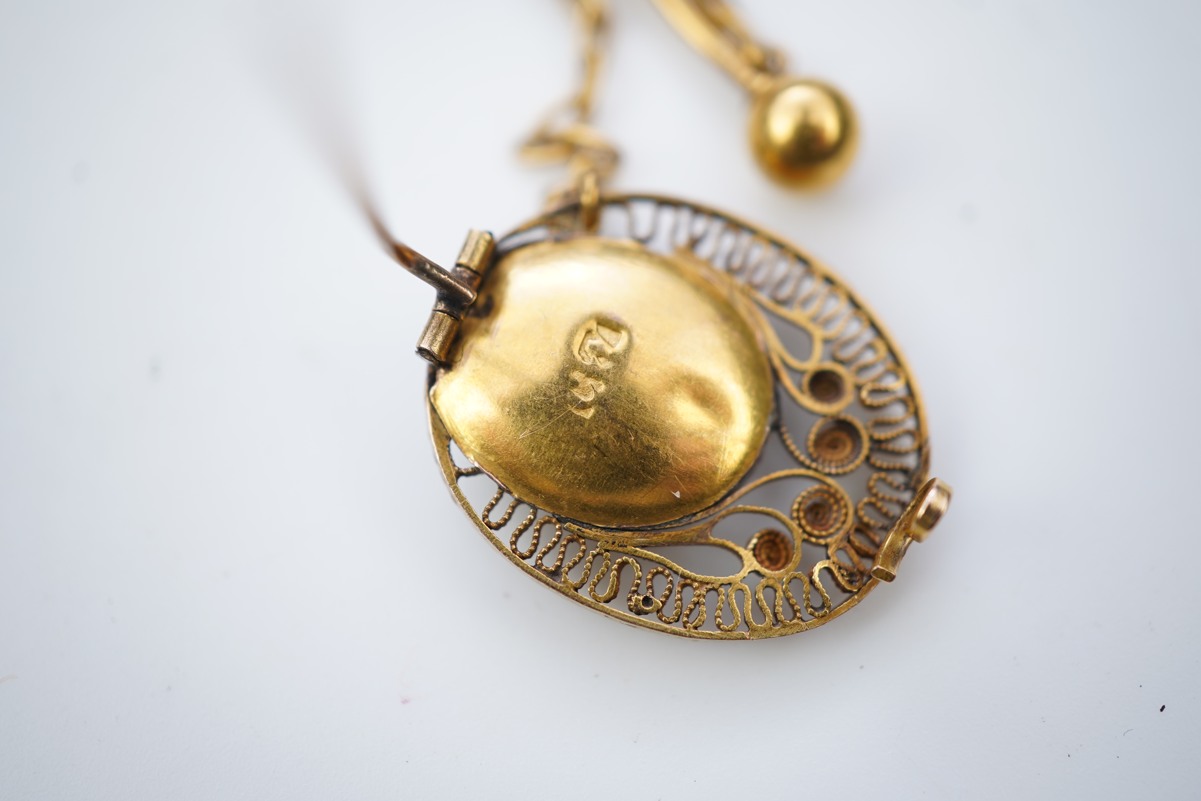 A collection of shell cameo brooches, comprising: a cameo depicting Bacchus, in a gold mount in the Archaeological Revival style, decorated with rope twist and a twisted knife wire border, length 4.4cm; together with sev